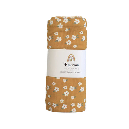 Floral-patterned blanket with Emerson label on a white background