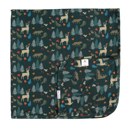 bamboo blanket with forest print on white background.