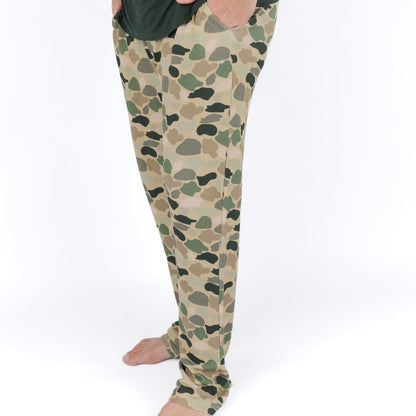 man wearing camo print pajama pants.