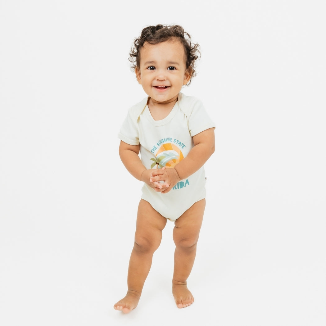 Florida Sunshine State baby bodysuit – soft & stretchy 100% cotton with unique vintage-inspired print, snap bottom, and fold-over shoulders for easy dressing.
