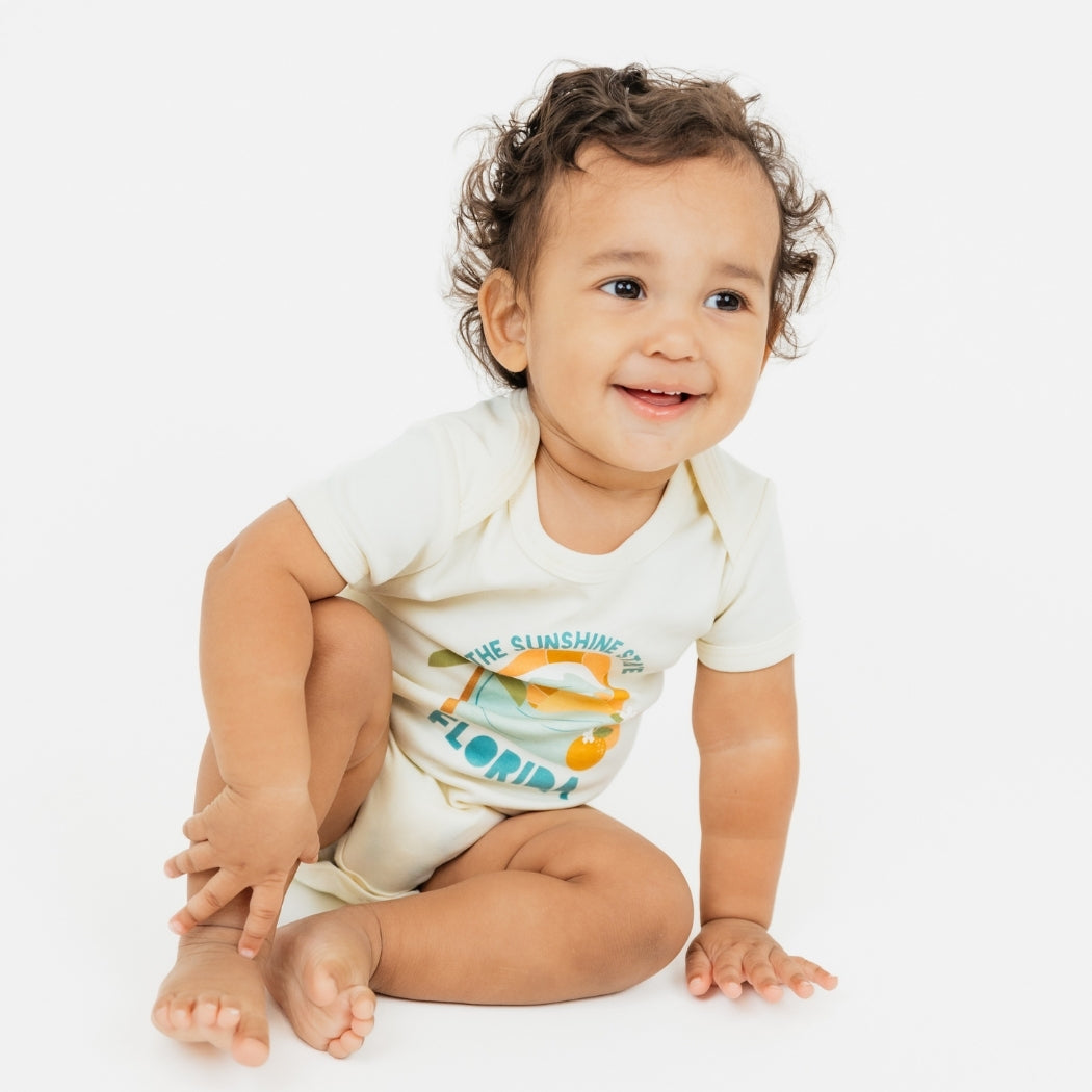 Florida Sunshine State baby bodysuit– soft & stretchy 100% cotton with unique vintage-inspired print, snap bottom, and fold-over shoulders for easy dressing.