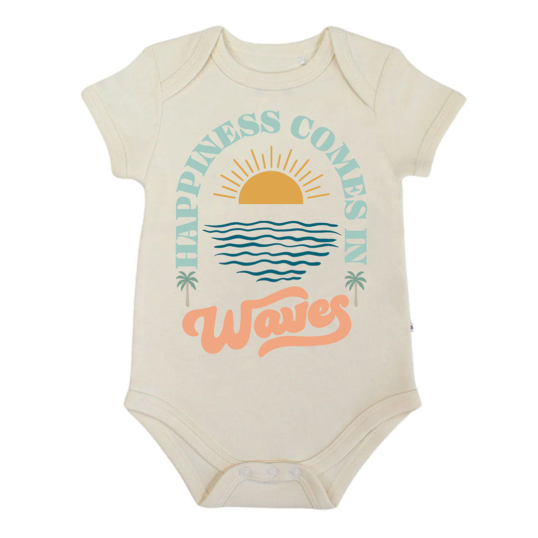 Beige baby bodysuit with 'Happiness Comes in Waves' text and graphics on a white background