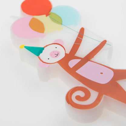 Cartoon monkey with colorful balloons on a white background