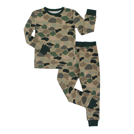 kids pajama set with camo print on white background.