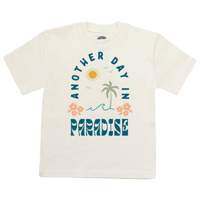 White t-shirt with 'Another Day in Paradise' design featuring palm trees and flowers on a white background