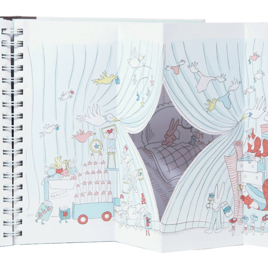 Illustrated children's book open to a page with a room scene and characters.
