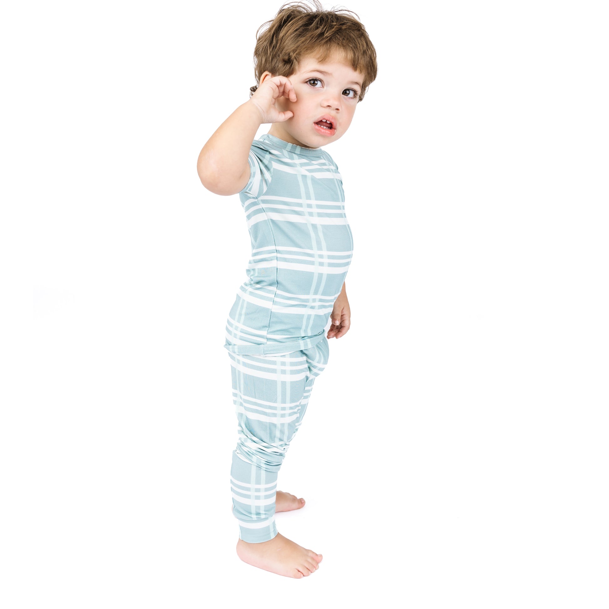 Child wearing a light blue and white striped outfit on a white background