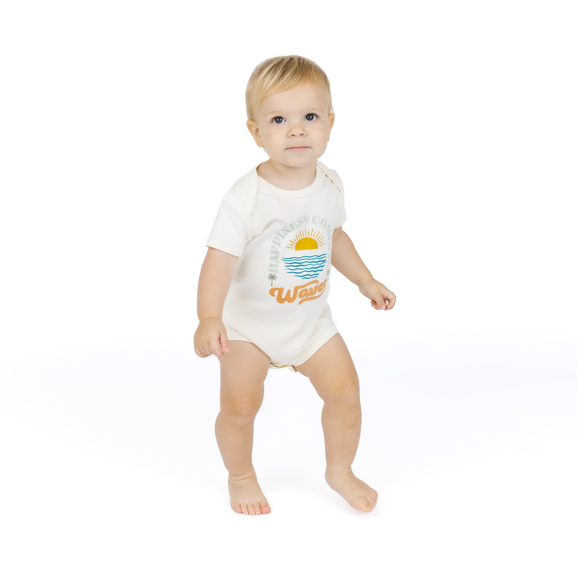 Baby wearing a white bodysuit with a graphic design on a white background
