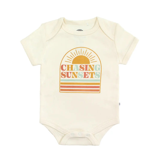 Baby bodysuit  with 'Chasing Sunsets' design on a white background