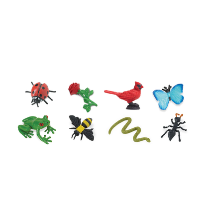 Set of colorful miniature animals and insects on a white background