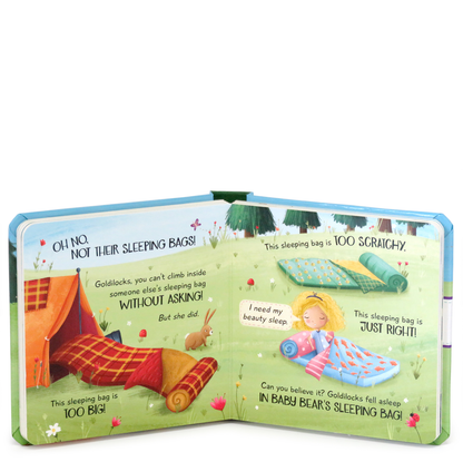 Open book with illustrations of Goldilocks and the three bears, featuring a green background and colorful characters.