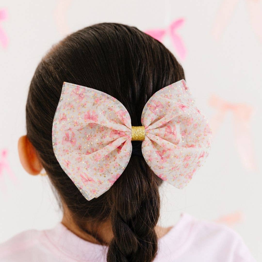 Person with a floral大发夹 in their hair against a light background