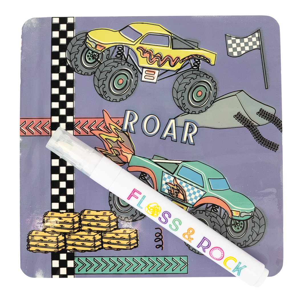 Children's book with monster truck illustrations and a pen on a white background