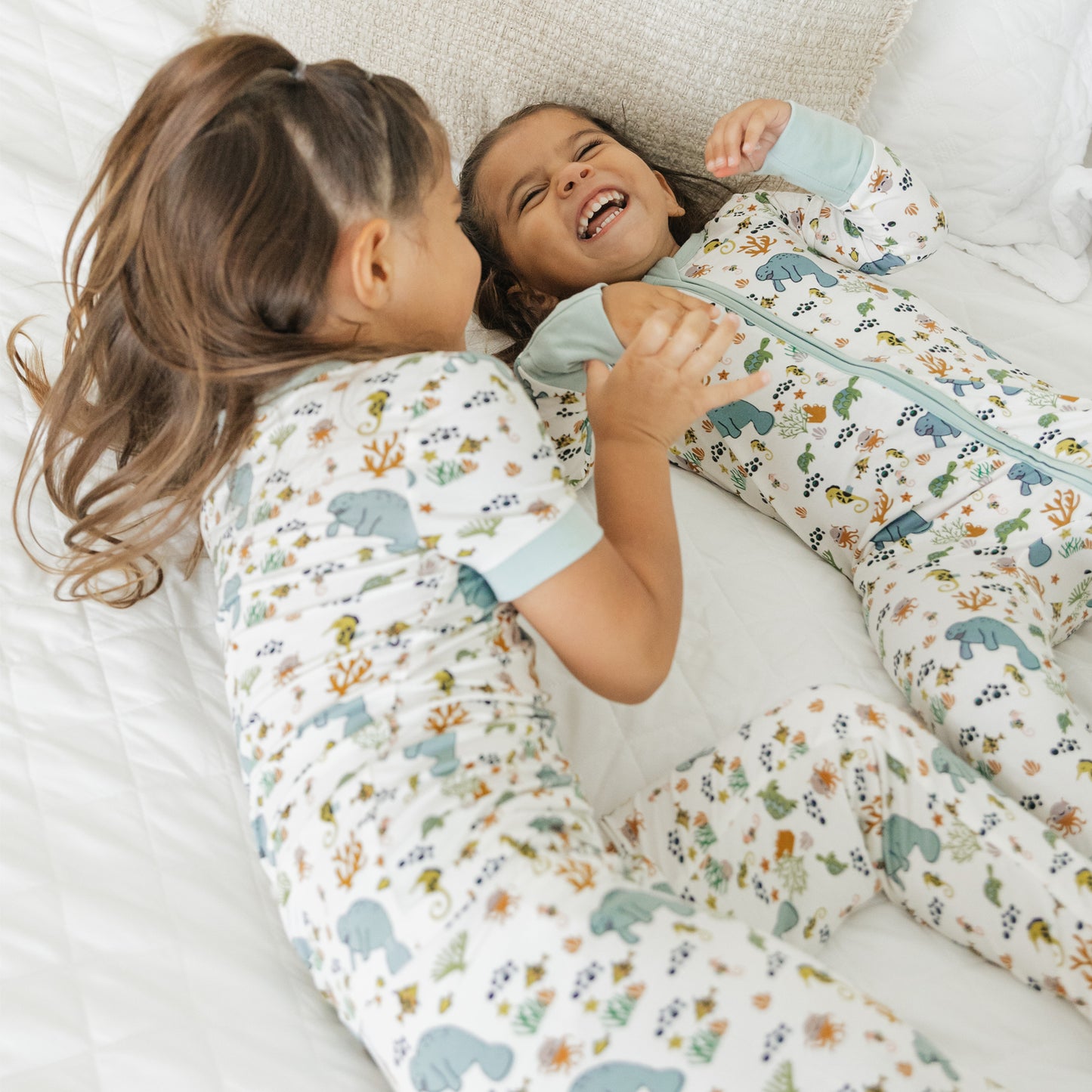 Close up of kids manatee bamboo pajama set showing soft fabric and ocean print design