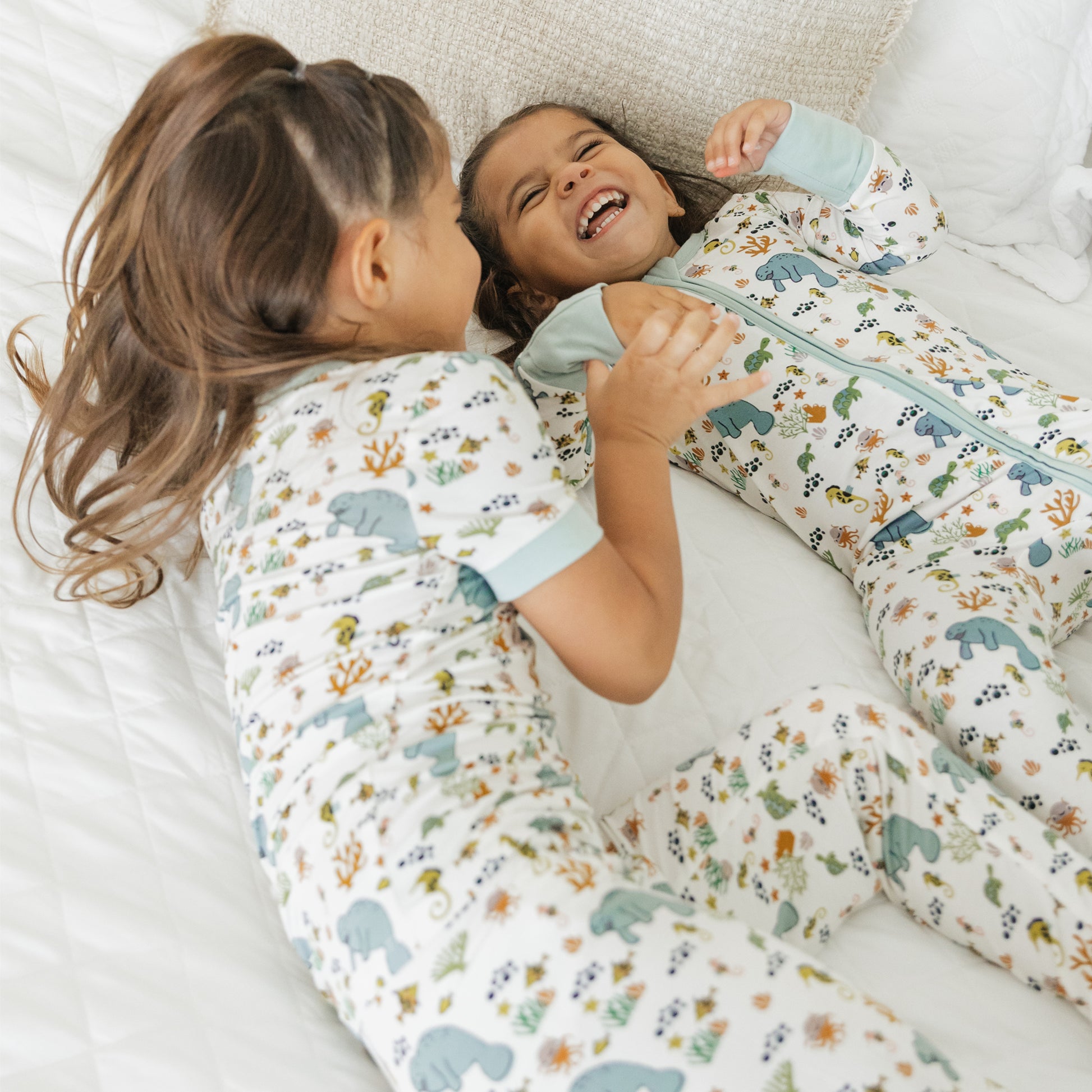Close up of kids manatee bamboo pajama set showing soft fabric and ocean print design