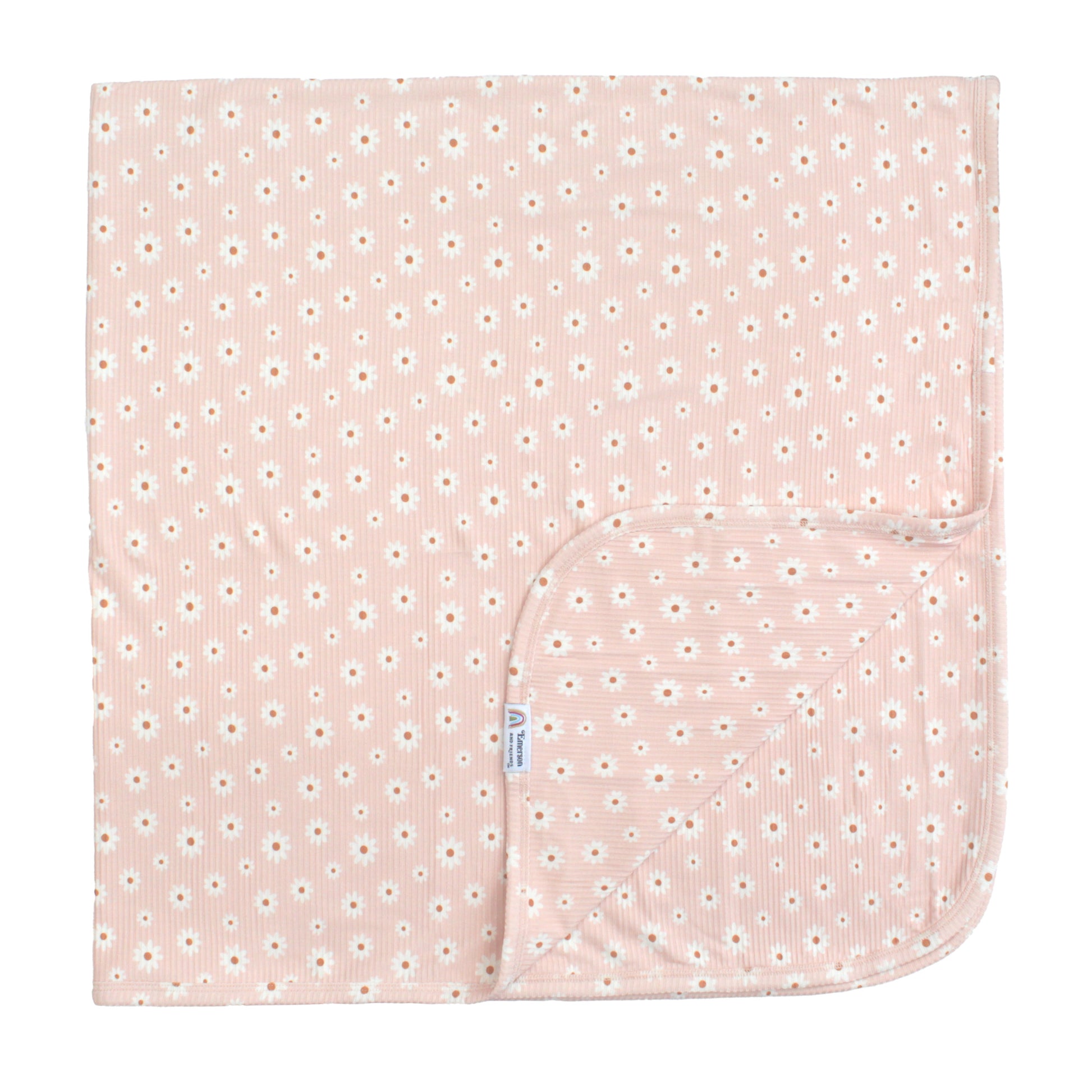 Pink baby blanket with white floral pattern on a white background