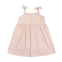 Pink dress with white floral pattern on a white background
