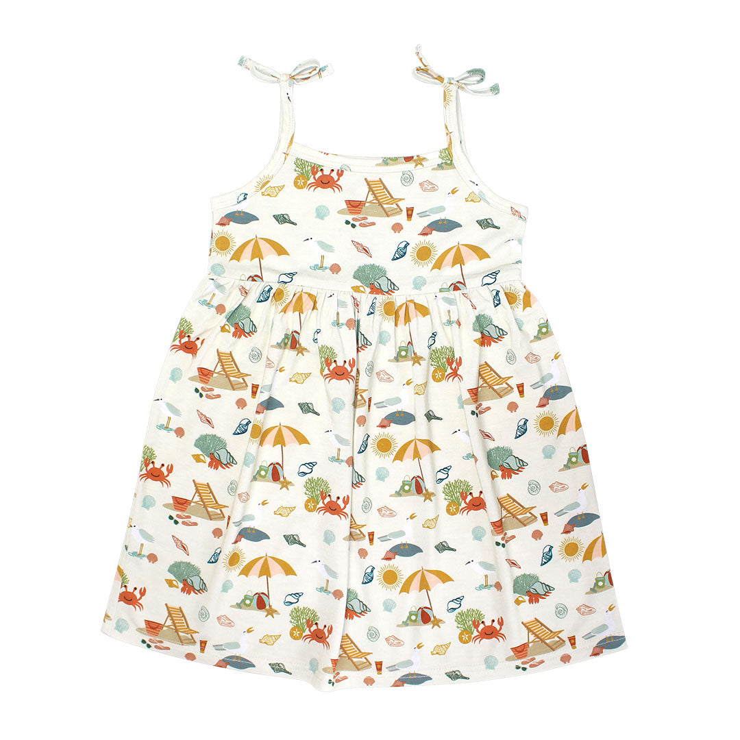 the "beach day" bamboo sundress. the "beach days" print is a scattered print of beach umbrellas, beach balls, sand buckets and shovels, coral, shells, beach chairs, seagulls, flipflops, and sunglass mixed in a orderly and creative way. 