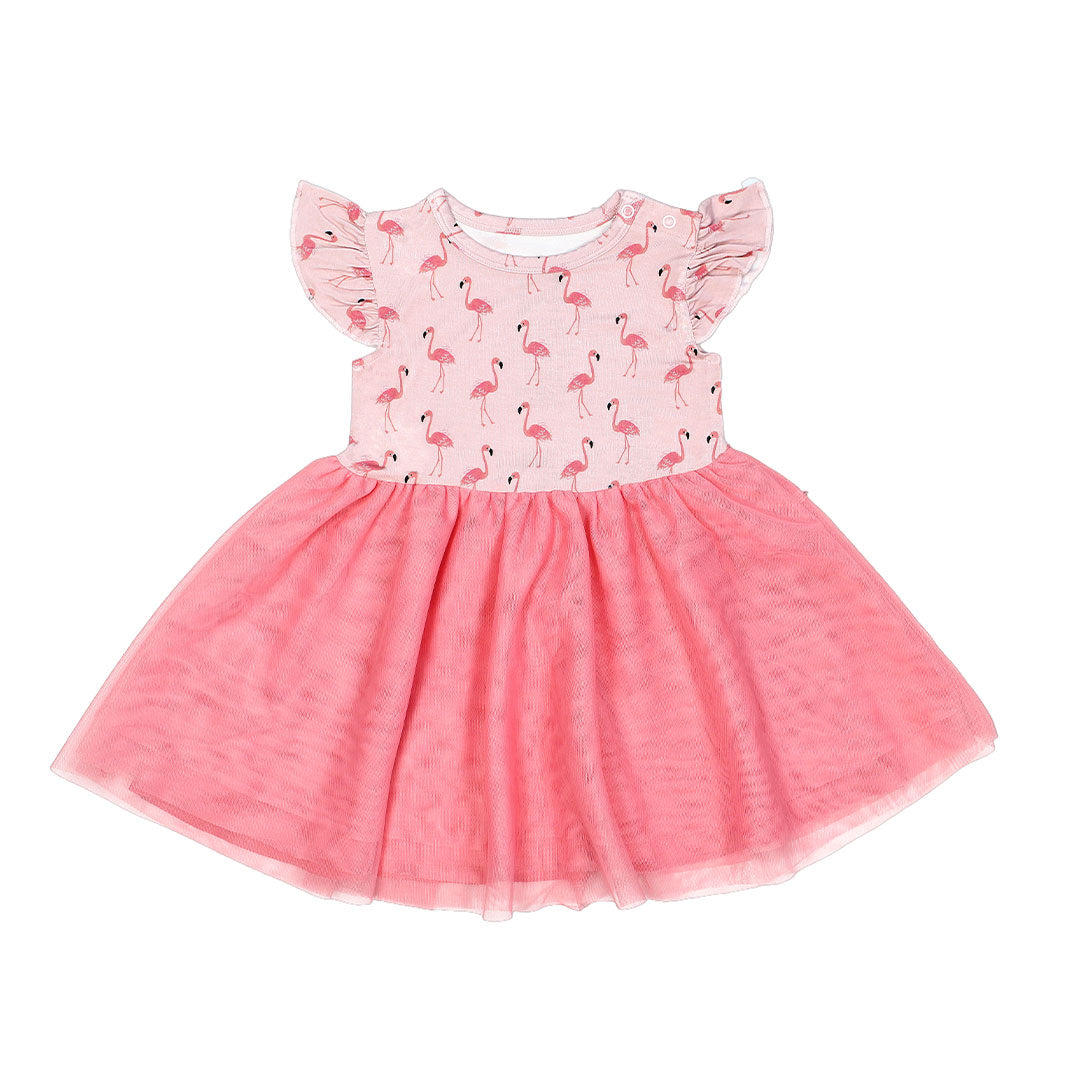the "fancy flamingos" twirl dress. this features the "fancy flamingos" print on the top half, and a bright pink bottom half of the dress. the "fancy flamingos" print is a pattern of multiple pink flamingoes scattered around the print. 