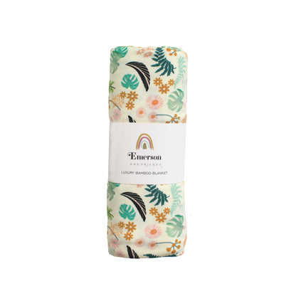 Close-up of the Tropical Blooms floral pattern on soft, stretchy bamboo viscose and spandex fabric.