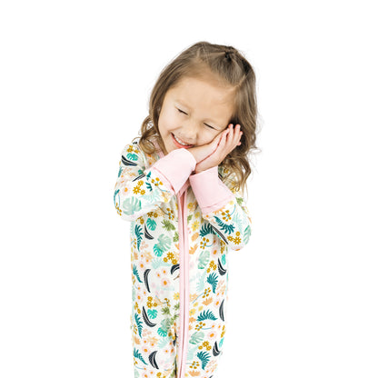Tropical Blooms bamboo convertible footie romper for babies featuring a vibrant botanical leaf and floral print on a light background.