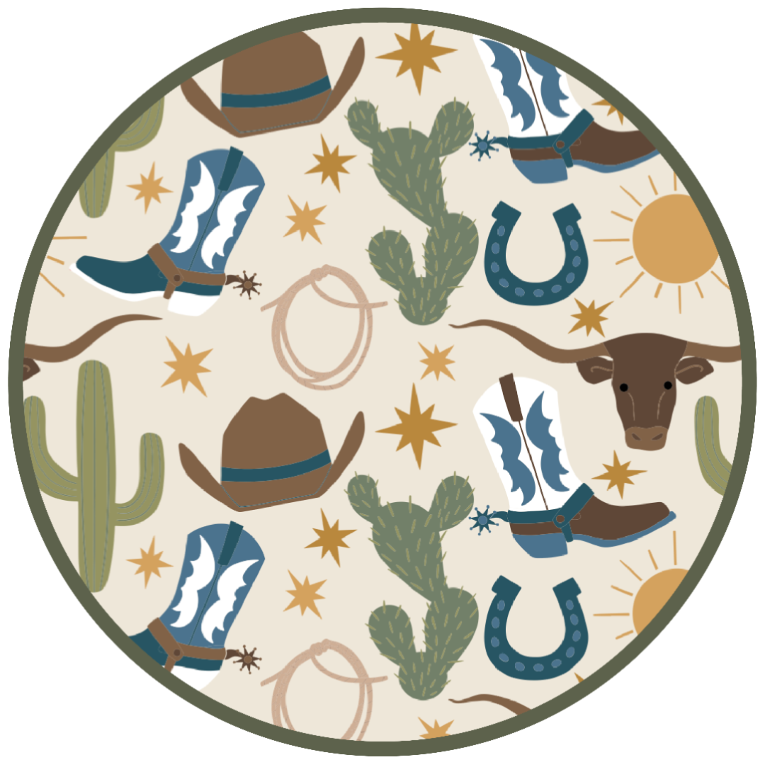 Our Western Howdy print circle featuring a charming cowboy-themed print with blue boots, cacti, suns, horseshoes, and cowboy hats. 
