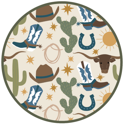 Our Western Howdy print circle featuring a charming cowboy-themed print with blue boots, cacti, suns, horseshoes, and cowboy hats. 