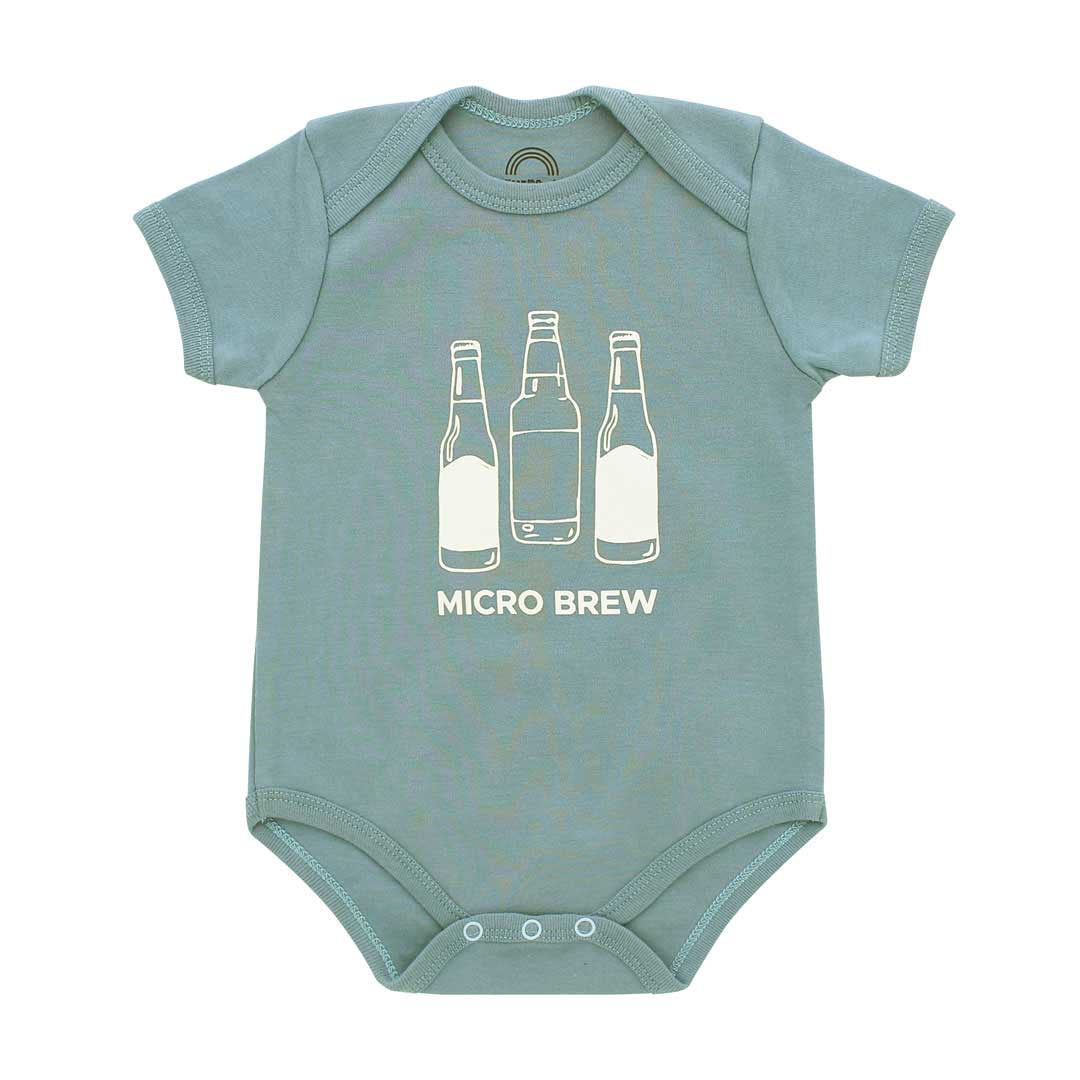 A short-sleeve baby bodysuit in dusty sage green with a white graphic of three beer bottles and the text 'MICRO BREW' printed on the chest, displayed flat against a white background.